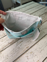 Load image into Gallery viewer, A fabric diaper bag pouch with a light blue and white striped pattern featuring bears shown on a rustic white-washed wooden background.