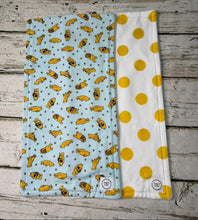 Load image into Gallery viewer, Set of 2 burp cloths. One is blue with yellow Winnie Pooh. Other is white with large yellow polka dots.
