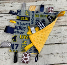 Load image into Gallery viewer, University of Michigan Baby Boy Minky Tag Blanket / U of M / Baby Boy Shower Gift / Lovey / Baby Toy / Snuggle Blanket / sensory blanket