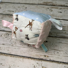 Load image into Gallery viewer, Sensory baby block made with Bambi print fabrics in blue and pink
