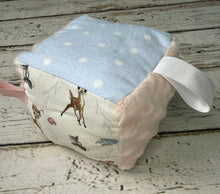 Load image into Gallery viewer, Sensory baby block made with Bambi print fabrics in blue and pink
