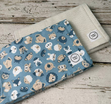 Load image into Gallery viewer, Set of 2 burp cloths.  One tan and white stripes, the other blue and tab animals
