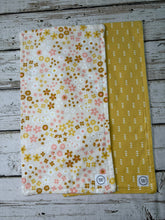 Load image into Gallery viewer, two burp cloths for baby girl with boho pink and gold flowers. and triangles
