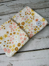 Load image into Gallery viewer, two burp cloths for baby girl with boho pink and gold flowers. and triangles
